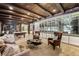 Elegant living room with custom ceiling, wet bar, and large display cabinet at 7188 Raphael Ln, Littleton, CO 80125