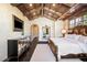 Luxurious main bedroom with custom dresser, wooden ceiling beams, and a cozy atmosphere for relaxation at 7188 Raphael Ln, Littleton, CO 80125