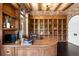 Home office featuring custom wood shelving, a spacious desk, and natural light at 7188 Raphael Ln, Littleton, CO 80125