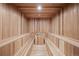 Lighted sauna with wood walls, wood benches and hot stone insert at 7188 Raphael Ln, Littleton, CO 80125