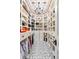 Spacious walk-in closet with custom shelving, drawers, and a chandelier providing ample storage at 7188 Raphael Ln, Littleton, CO 80125