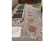 Backyard features a gravel walkway with stepping stones and raised garden beds at 11375 W Maplewood Ave, Littleton, CO 80127