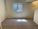 Basement featuring carpet and a window at 11375 W Maplewood Ave, Littleton, CO 80127