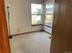 Bright bedroom with three sunny windows and neutral carpet at 11375 W Maplewood Ave, Littleton, CO 80127