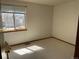 Spare bedroom with neutral carpet and blind-covered window at 11375 W Maplewood Ave, Littleton, CO 80127