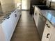 Modern kitchen boasts stainless steel appliances, granite countertops, and stylish cabinetry at 11375 W Maplewood Ave, Littleton, CO 80127