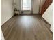 Spacious living room featuring neutral walls, new flooring, and a stairway to the upper level at 11375 W Maplewood Ave, Littleton, CO 80127