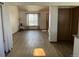 Open floor plan featuring modern floors, a sitting area, and natural light at 11375 W Maplewood Ave, Littleton, CO 80127