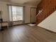 Entry way and living room showcasing stairway and modern flooring at 11375 W Maplewood Ave, Littleton, CO 80127