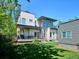 Backyard view of a modern home with a well-manicured lawn and outdoor patio area at 2508 S Pennsylvania St, Denver, CO 80210
