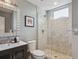 Bathroom featuring a walk-in shower with decorative tile and modern fixtures at 2508 S Pennsylvania St, Denver, CO 80210