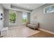 Bright room with large windows, a cozy sofa, and stylish decor at 2508 S Pennsylvania St, Denver, CO 80210