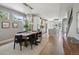 Dining area with a modern chandelier and an adjacent kitchen, creating an inviting space at 2508 S Pennsylvania St, Denver, CO 80210
