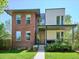 Modern two-story home with a mix of brick and siding, complemented by a well-manicured lawn at 2508 S Pennsylvania St, Denver, CO 80210