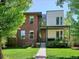 Stunning modern home with a brick and siding exterior, a well-manicured lawn, and a welcoming front porch at 2508 S Pennsylvania St, Denver, CO 80210