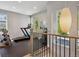 Home gym with a treadmill and weight rack, visible from the upper landing at 2508 S Pennsylvania St, Denver, CO 80210