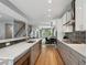 Spacious kitchen with stainless appliances and a stylish design flowing into the dining area at 2508 S Pennsylvania St, Denver, CO 80210