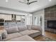 Open-concept living space with a fireplace, kitchen, and a large, comfortable couch at 2508 S Pennsylvania St, Denver, CO 80210