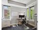 Bright office space with natural light, featuring a modern desk, chair, and ample storage at 2508 S Pennsylvania St, Denver, CO 80210