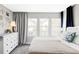 Bedroom with neutral carpet, white walls, large windows with curtains, and white dresser at 8917 Yates Dr, Westminster, CO 80031