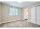 Bright bedroom with modern closet doors and an ensuite bathroom at 8917 Yates Dr, Westminster, CO 80031