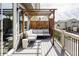 Outdoor deck with modern patio furniture and a wooden pergola for shade in an outdoor setting at 8917 Yates Dr, Westminster, CO 80031