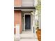 Close-up of the front door with modern hardware and clear house number. Inviting entrance at 8917 Yates Dr, Westminster, CO 80031