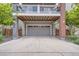 Attached two-car garage with finished driveway beneath a charming balcony at 8917 Yates Dr, Westminster, CO 80031