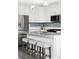 Bright kitchen featuring stainless steel appliances, ample counter space, and bar stool seating at 8917 Yates Dr, Westminster, CO 80031