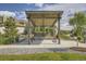 Outdoor pavilion with seating and landscaping in a community area at 8917 Yates Dr, Westminster, CO 80031
