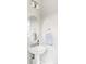Stylish powder room featuring a modern sink, elegant mirror, and tasteful decor at 8917 Yates Dr, Westminster, CO 80031