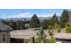 Scenic view from a window overlooking a street with mountains in the background at 8917 Yates Dr, Westminster, CO 80031