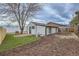 Expansive backyard featuring a well-maintained lawn, privacy fencing and mature landscaping at 3379 S Eliot St, Englewood, CO 80110