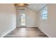 Cozy room with luxury vinyl plank flooring, ample natural light, and clean, neutral walls at 3379 S Eliot St, Englewood, CO 80110