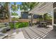 Backyard featuring a covered patio, green lawn, and wood fence at 9478 Burgundy Cir, Highlands Ranch, CO 80126