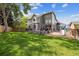 The backyard features a large deck perfect for outdoor entertaining and a play area at 9478 Burgundy Cir, Highlands Ranch, CO 80126