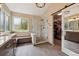 Modern bathroom with glass shower, dual vanity, and walk-in closet at 9478 Burgundy Cir, Highlands Ranch, CO 80126