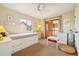 Cozy bedroom with natural light, a built-in bed frame, and access to a balcony at 9478 Burgundy Cir, Highlands Ranch, CO 80126