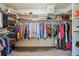 Walk-in closet with ample storage space and shelving for clothes, shoes, and accessories at 9478 Burgundy Cir, Highlands Ranch, CO 80126