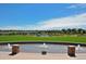 Scenic community park view featuring green space, water features, and beautiful landscaping on a bright, sunny day at 9478 Burgundy Cir, Highlands Ranch, CO 80126