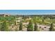 Beautiful community park with lush landscaping, walking paths, water feature and a charming gazebo at 9478 Burgundy Cir, Highlands Ranch, CO 80126