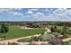 Expansive community park featuring a well-maintained lawn, inviting walking paths, and a charming shaded pavilion at 9478 Burgundy Cir, Highlands Ranch, CO 80126