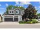 Charming two-story home with a basketball hoop, well-maintained lawn, and beautifully landscaped yard at 9478 Burgundy Cir, Highlands Ranch, CO 80126