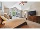Spacious main bedroom with natural light, a large window, and en-suite bathroom access at 9478 Burgundy Cir, Highlands Ranch, CO 80126