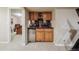 Basement wet bar complete with a mini fridge, cabinets, and counter space for serving beverages at 9478 Burgundy Cir, Highlands Ranch, CO 80126