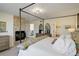 Stylish main bedroom boasting a fireplace and view into the ensuite bathroom at 4930 Laurelglen Ln, Highlands Ranch, CO 80130