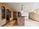 Basement wet bar and wood storage unit with hardwood floors and unique decor at 2409 E Cedar Ave, Denver, CO 80209