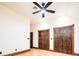 Bedroom with hardwood floors and dark trim along the baseboards and wooden doors at 2409 E Cedar Ave, Denver, CO 80209