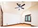 Bright bedroom featuring a ceiling fan, window with shutters, and hardwood floors at 2409 E Cedar Ave, Denver, CO 80209