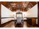 Elegant dining room with coffered ceilings, hardwood floors, a chandelier, and beautiful natural light at 2409 E Cedar Ave, Denver, CO 80209